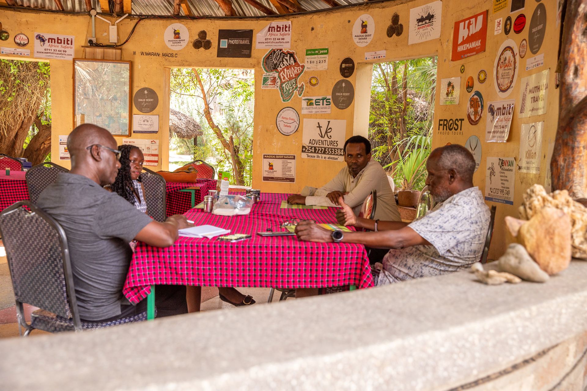 A community learning session inside a Kivulini Trust meeting space.