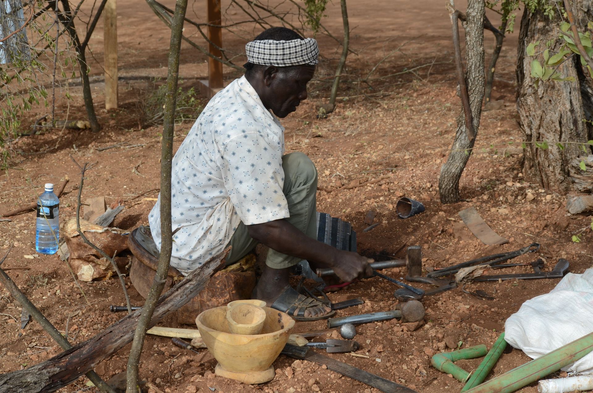 A craftsman at work within a pastoralist homestead.
