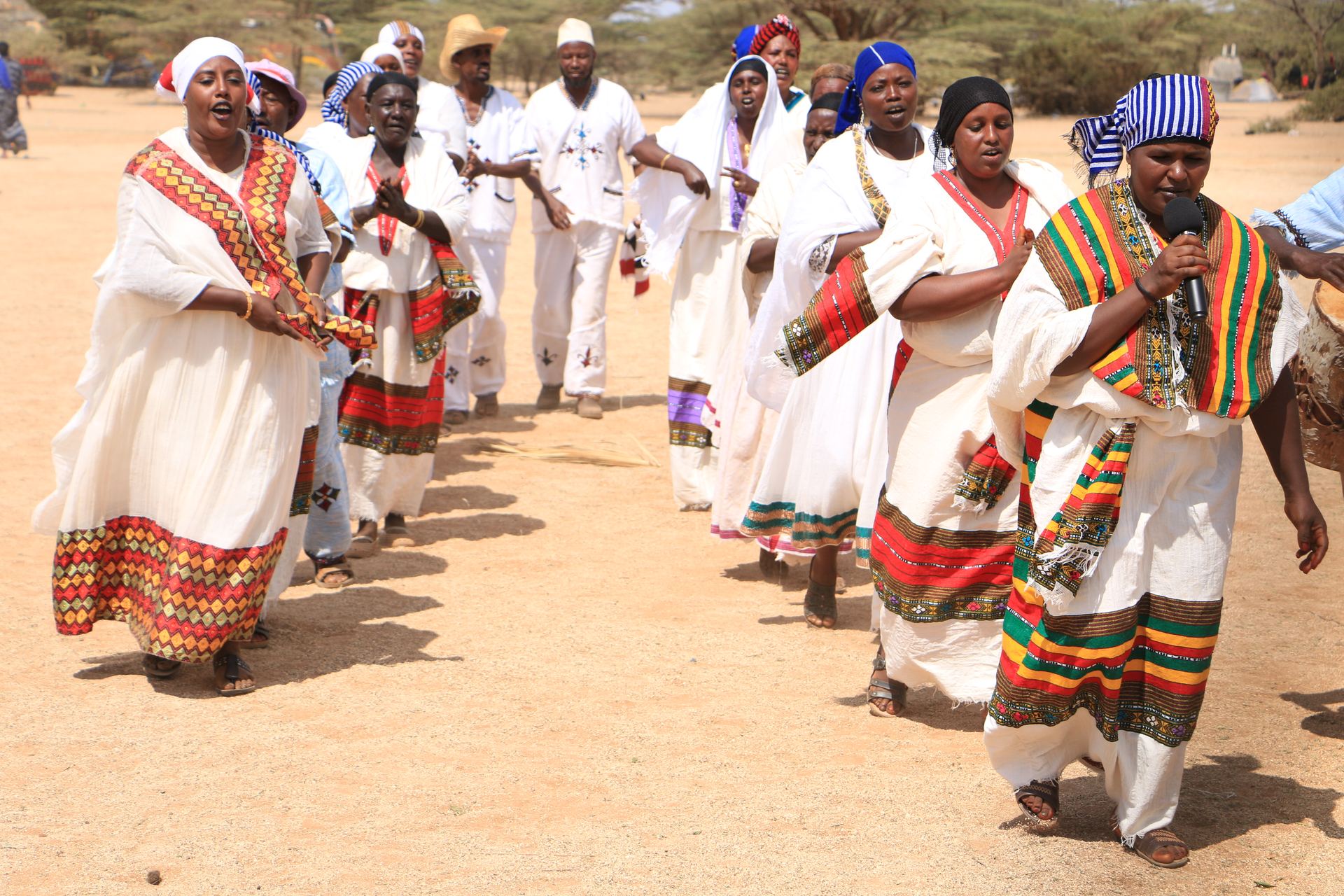 Elders gather in traditional white dress at the Kalacha Cultural Centre.